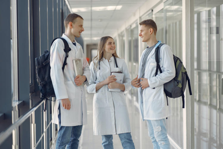 Nursing students in lab coats
